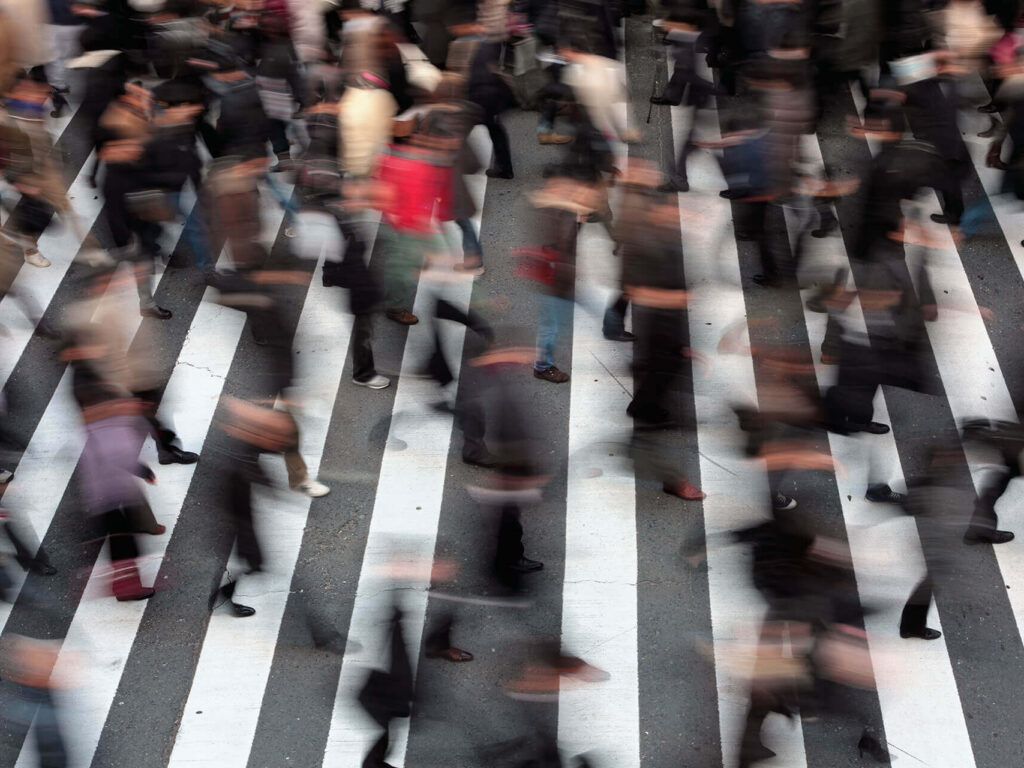 heavy pedestrian traffic moving through street